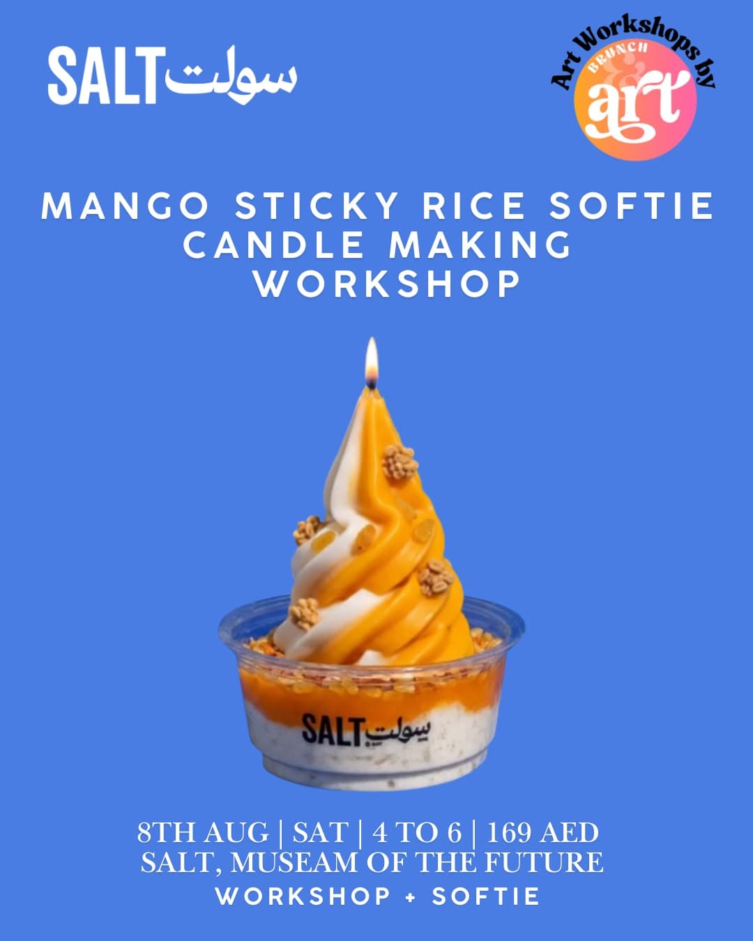 A mango softie shaped candle lit against a blue backdrop